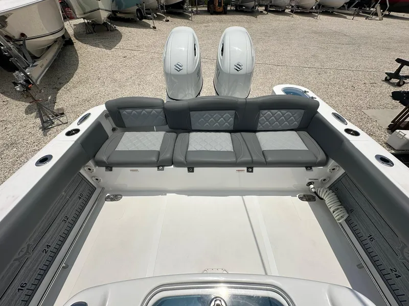 Slide: The Image of 2024 NauticStar 252 boat with dual engines and spacious seating. - 17