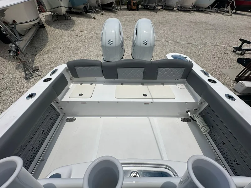 Slide: The Image of 2024 NauticStar 252 boat interior with twin outboard engines. - 19