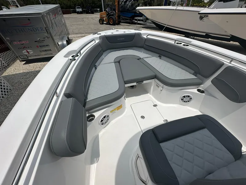Slide: The Image of 2024 NauticStar 252 boat interior with gray and white seating. - 8