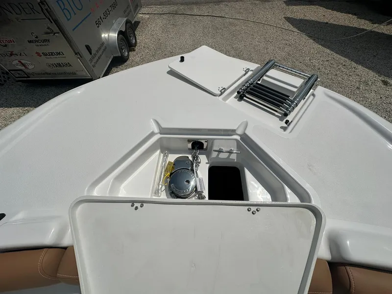 Slide: The Image of 2024 NauticStar 251 boat bow with anchor storage and ladder. - 15
