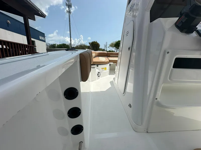 Slide: The Image of 2024 NauticStar 251 boat interior with seating and storage compartments. - 16