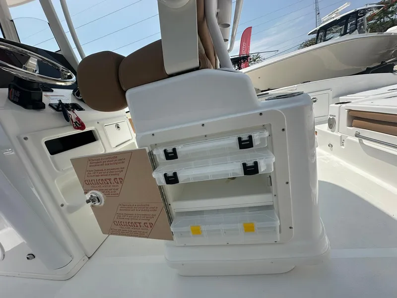 Slide: The Image of 2024 NauticStar 251 boat interior with storage compartments and seating. - 24