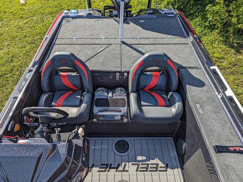 Slide: The Image of 2025 Bass Cat Jaguar boat interior with dual seats and modern dashboard. - 10