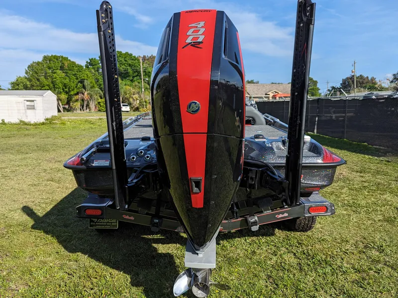 Slide: The Image of 2025 Bass Cat Jaguar boat with powerful 400R engine, rear view. - 13