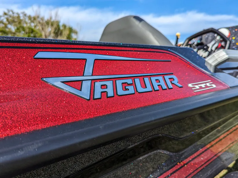 Slide: The Image of 2025 Bass Cat Jaguar STS boat with red metallic finish. - 7