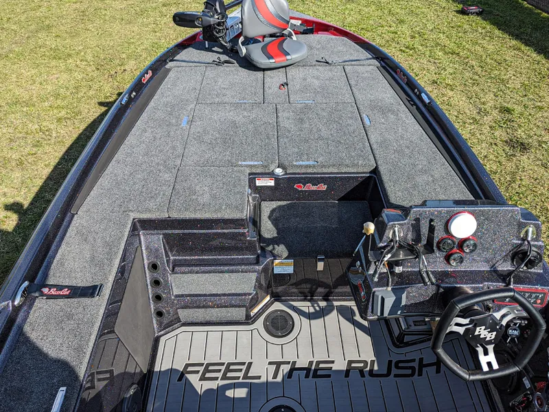 Slide: The Image of 2025 Bass Cat Jaguar boat interior with Feel the Rush slogan on deck. - 8