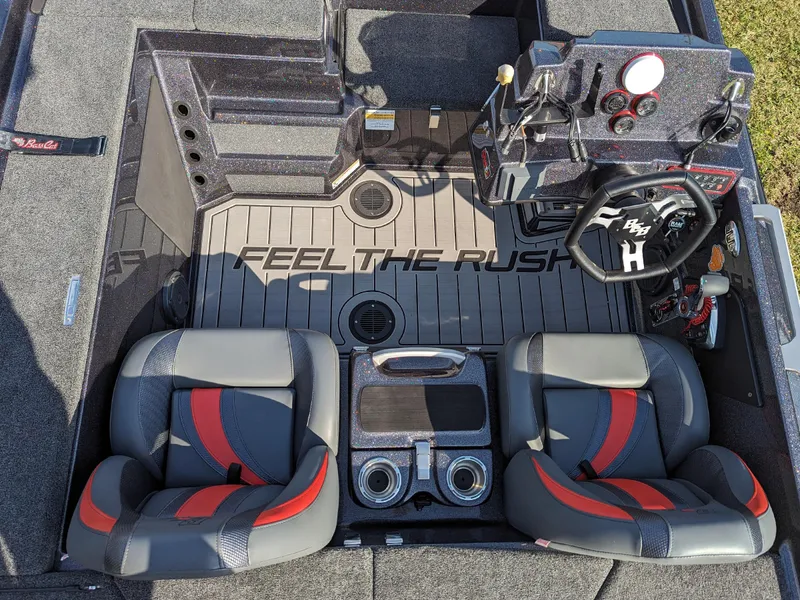 Slide: The Image of 2025 Bass Cat Jaguar boat interior with dual seats and Feel the Rush flooring. - 9