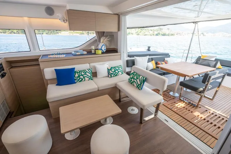 Slide: The Image of Luxurious interior of 2025 Lagoon 43 yacht with modern seating and dining area. - 12
