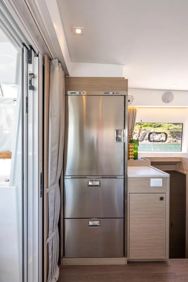 Slide: The Image of Modern kitchen interior of 2025 Lagoon 43 yacht with stainless steel appliances. - 23