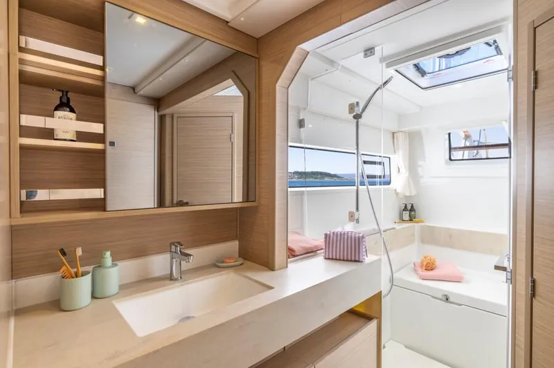 Slide: The Image of Luxurious bathroom interior of 2025 Lagoon 43 yacht with modern fixtures and natural light. - 28