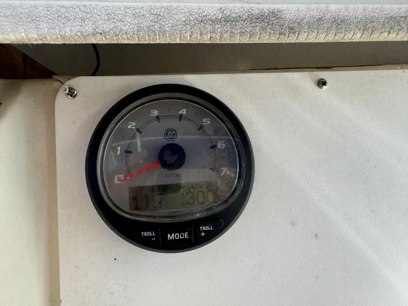 Slide: The Image of Close-up of a tachometer on a 1989 Pursuit 230 Center Console boat. - 8