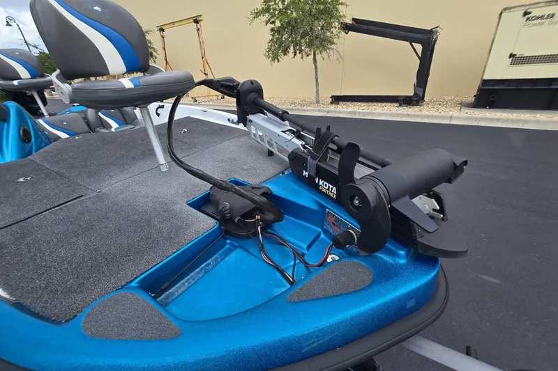 Slide: The Image of 2024 Bass Cat Bobcat Vision boat with Minn Kota Fortrex trolling motor, blue interior. - 9