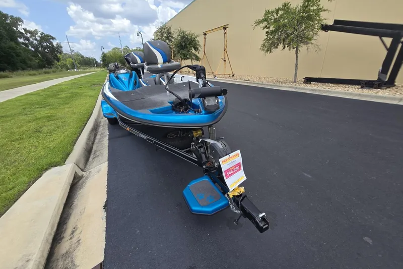 Slide: The Image of 2024 Bass Cat Bobcat Vision boat parked on a street, showcasing sleek design. - 7