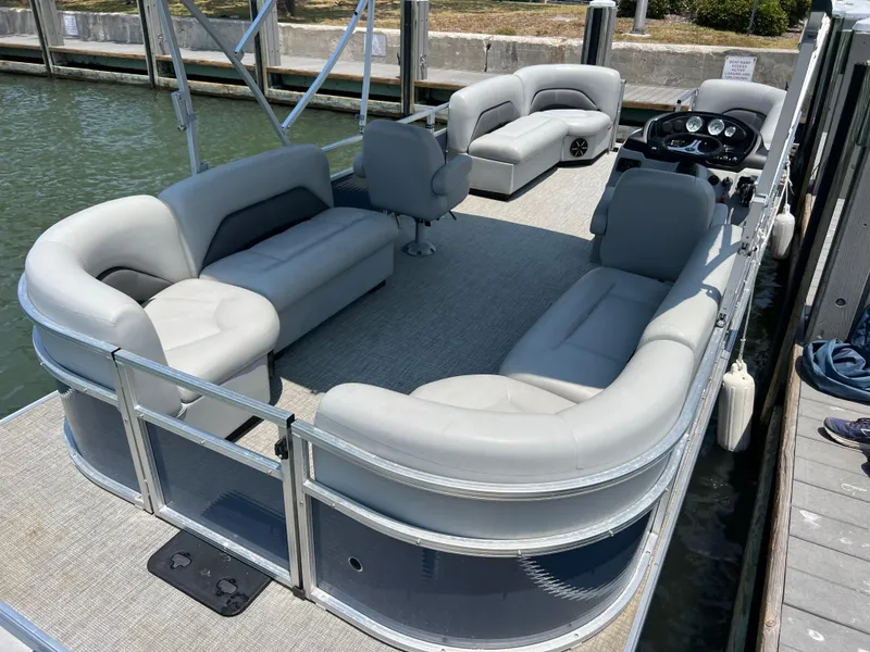 The Image of 2023 Landau Island Breeze 232 pontoon boat with spacious seating at dock. - 1