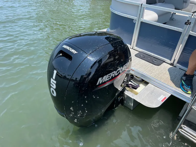 Slide: The Image of 2023 Landau Island Breeze 232 with Mercury 150 outboard motor in water. - 11