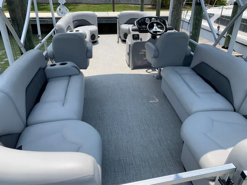 Slide: The Image of 2023 Landau Island Breeze 232 pontoon boat with spacious seating and modern interior. - 18
