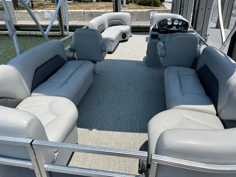 Slide: The Image of 2023 Landau Island Breeze 232 pontoon boat with spacious seating and modern design. - 2