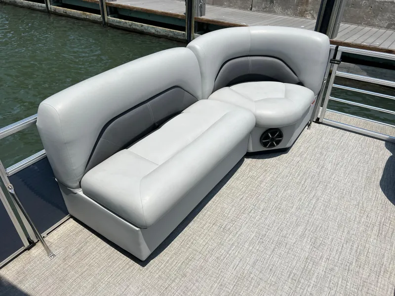 Slide: The Image of 2023 Landau Island Breeze 232 pontoon boat seating area with gray upholstery. - 6