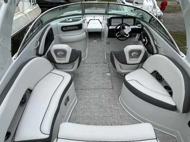 Slide: The Image of 2024 Crownline 270 XSS boat interior with modern seating and dashboard. - 2