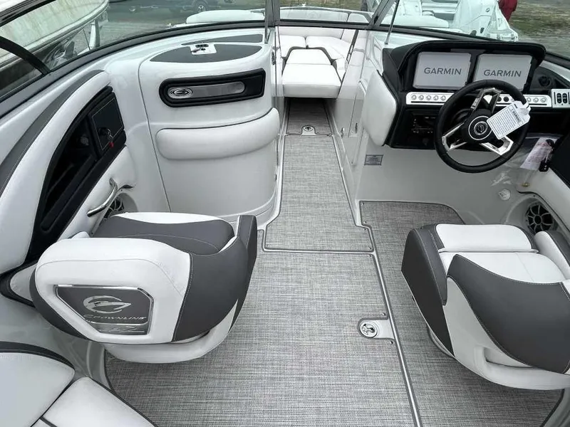 Slide: The Image of 2024 Crownline 270 XSS boat interior with Garmin navigation system and modern seating. - 4