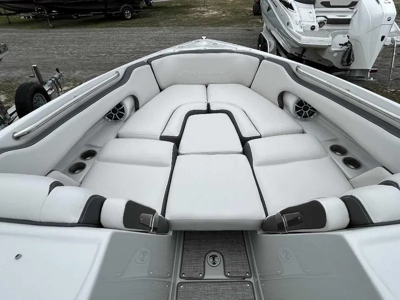 Slide: The Image of 2024 Crownline 270 XSS boat interior with white cushioned seating. - 5