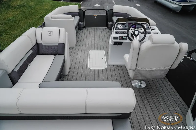 Slide: The Image of 2021 Godfrey SWEETWATER 2286 SFL pontoon boat interior with plush seating and modern helm. - 10