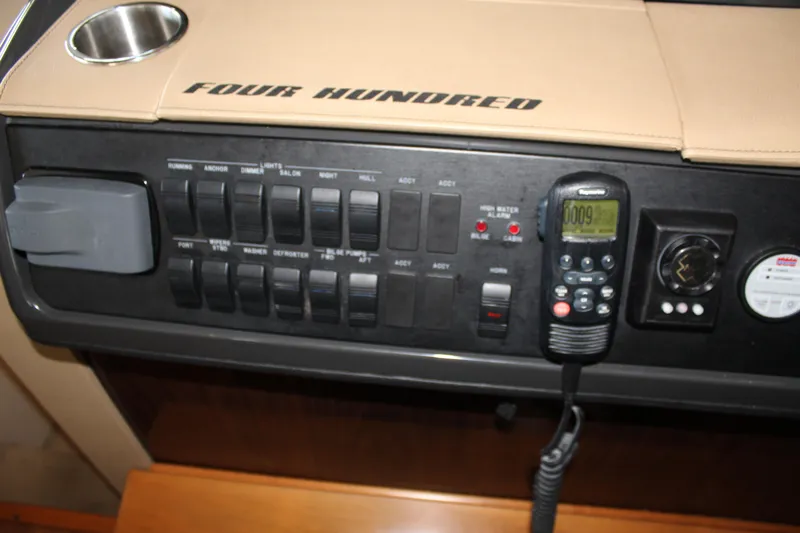 Slide: The Image of Control panel of a 2016 Sea Ray 400 Sundancer boat. - 28