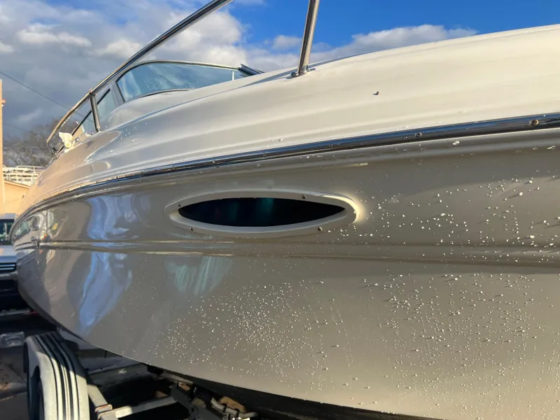 Slide: The Image of 1998 Sea Ray 210 Cuddy Cabin boat on trailer, close-up view. - 1