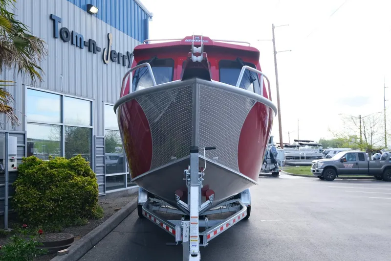 Slide: The Image of 2024 Hewescraft 270 Alaskan boat on trailer outside dealership. - 4