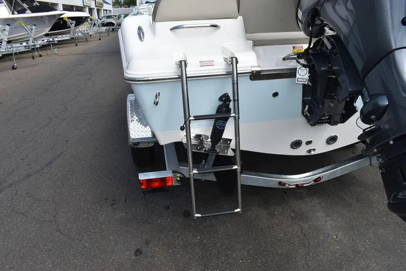 Slide: The Image of 2024 Key West 189 FS boat with ladder and motor on trailer. - 15