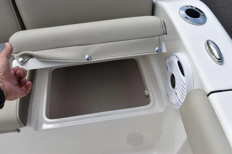 Slide: The Image of 2024 Key West 189 FS boat seat storage compartment with speaker and cup holder. - 19