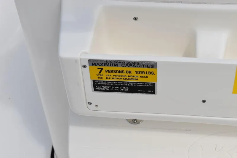 Slide: The Image of 2024 Key West 189 FS boat capacity label, 7 persons or 1019 lbs maximum. - 26