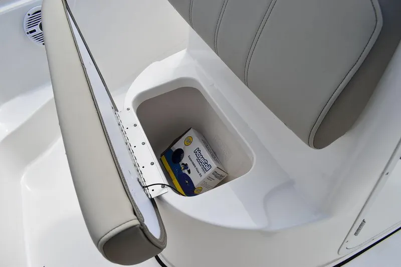 Slide: The Image of 2024 Key West 189 FS boat seat storage with a box inside. - 31
