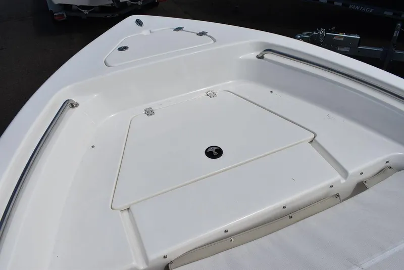 Slide: The Image of 2024 Key West 189 FS boat deck with storage compartment and stainless steel rails. - 33