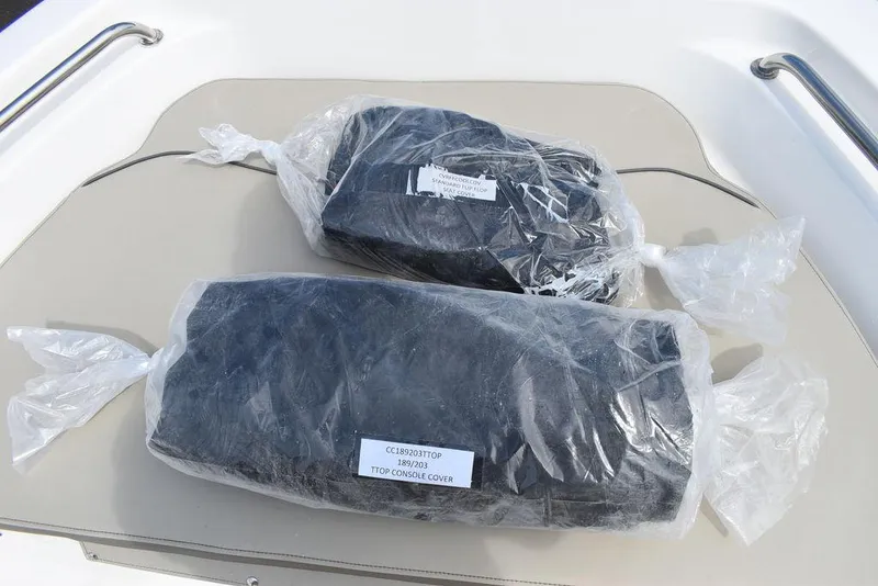 Slide: The Image of Two packaged items on a 2024 Key West 189 FS boat seat. - 38