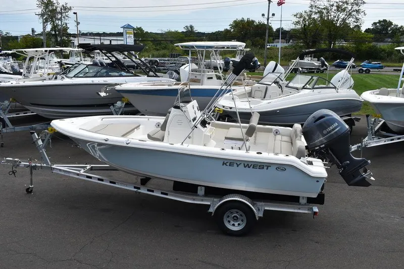 Slide: The Image of 2024 Key West 189 FS boat on trailer, parked in a marina lot. - 4