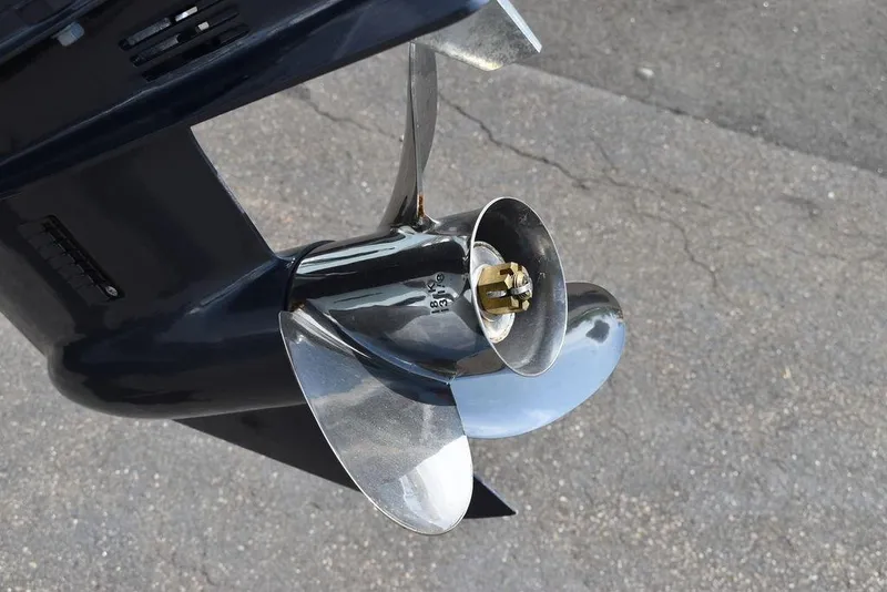 Slide: The Image of Close-up of a 2024 Key West 189 FS boat propeller on pavement. - 44