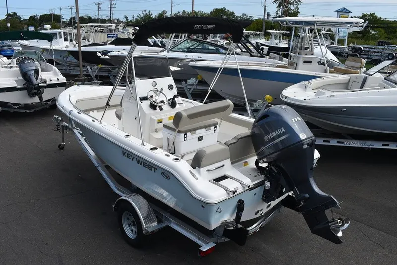 Slide: The Image of 2024 Key West 189 FS boat with Yamaha engine on trailer in marina. - 5
