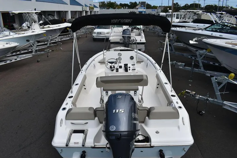 Slide: The Image of 2024 Key West 189 FS boat with 115 HP engine, displayed in a dealership. - 7