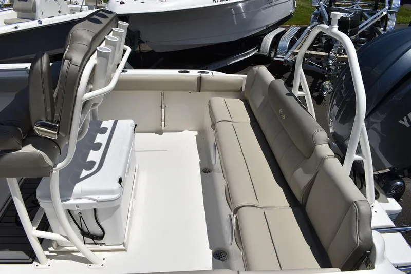Slide: The Image of 2024 Key West 219 FS boat interior with seating and cooler. - 14