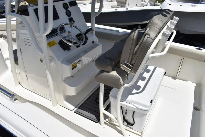 Slide: The Image of 2024 Key West 219 FS boat console and seating area. - 15