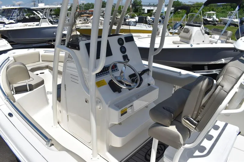 Slide: The Image of 2024 Key West 219 FS boat interior with console and seating. - 16