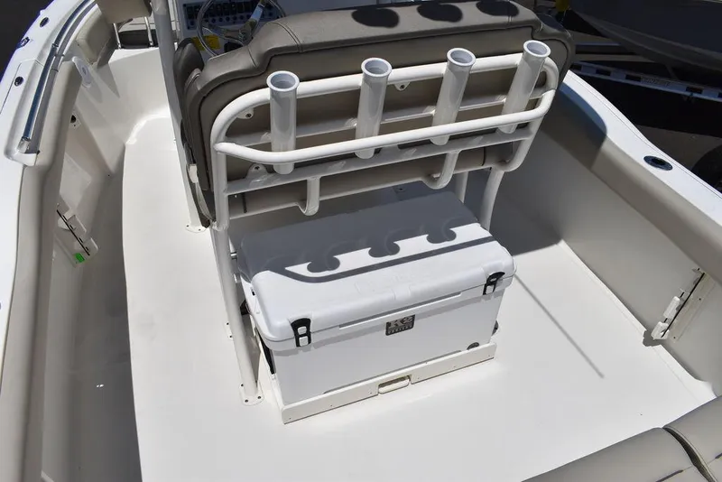 Slide: The Image of 2024 Key West 219 FS boat with rod holders and cooler storage. - 22