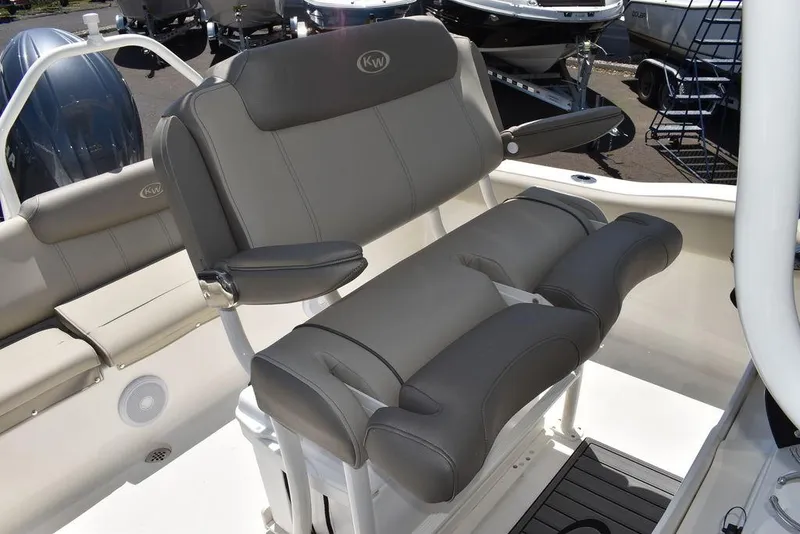 Slide: The Image of 2024 Key West 219 FS boat with cushioned seating and backrest. - 32