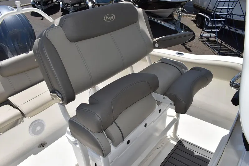 Slide: The Image of 2024 Key West 219 FS boat with cushioned seating and backrest. - 33