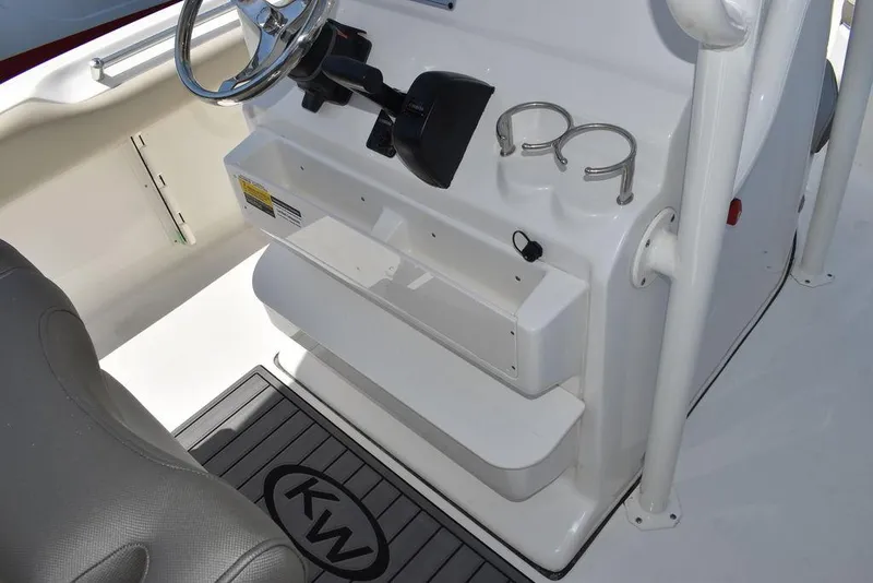 Slide: The Image of 2024 Key West 219 FS boat console with steering wheel and cup holders. - 34