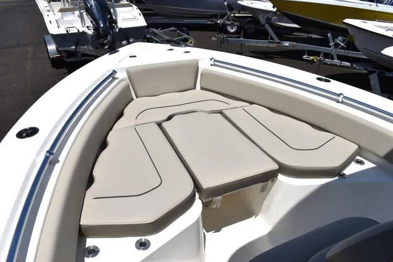 Slide: The Image of 2024 Key West 219 FS boat with cushioned bow seating area. - 49
