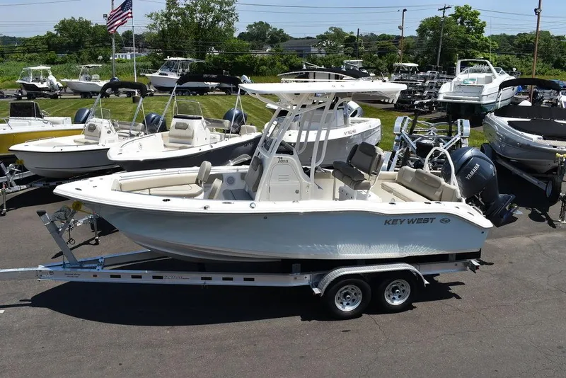 Slide: The Image of 2024 Key West 219 FS boat on a trailer in a marina. - 5