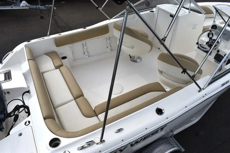 Slide: The Image of 2018 Key West 203DFS boat interior with beige and white seating. - 10
