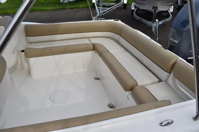 Slide: The Image of 2018 Key West 203DFS boat interior with beige and white seating. - 17